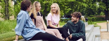 students sat on steps outside The Edge