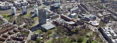 Aerial view of hexagonal Geography and Planning, green Weston Park and the Arts Tower
