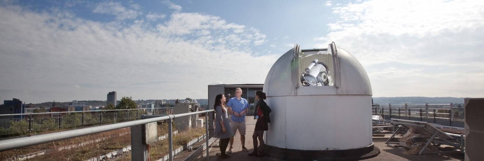Students with the University of Sheffield's rooftop telescopes