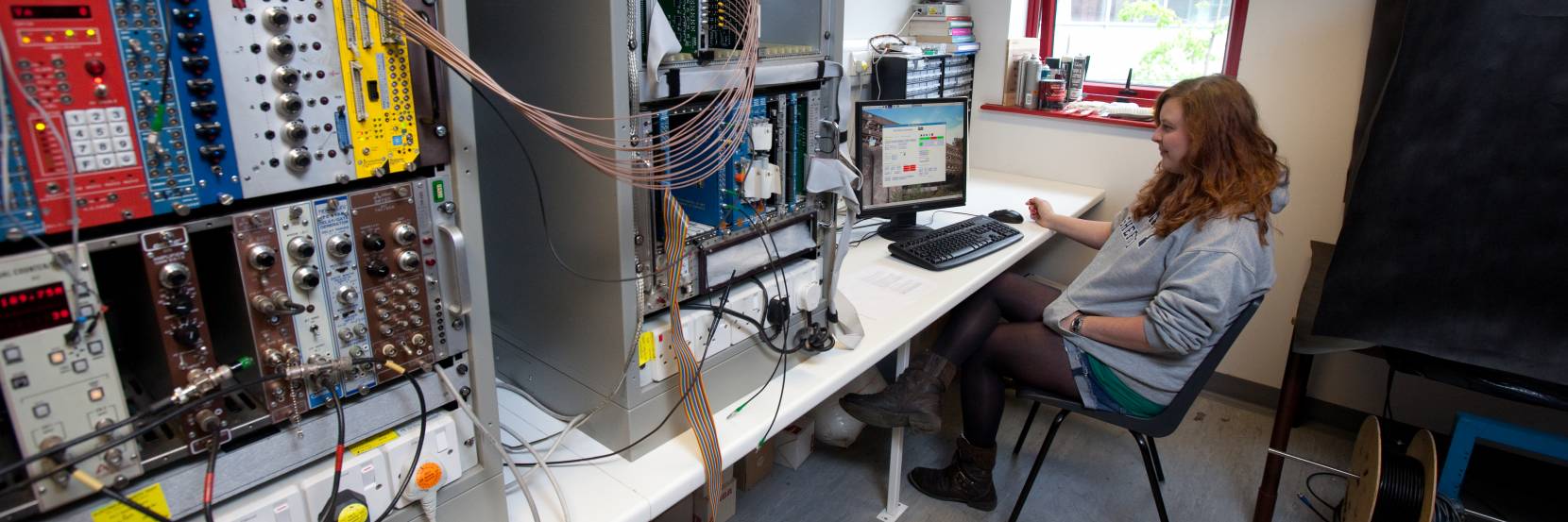 A student in a particle physics laboratory