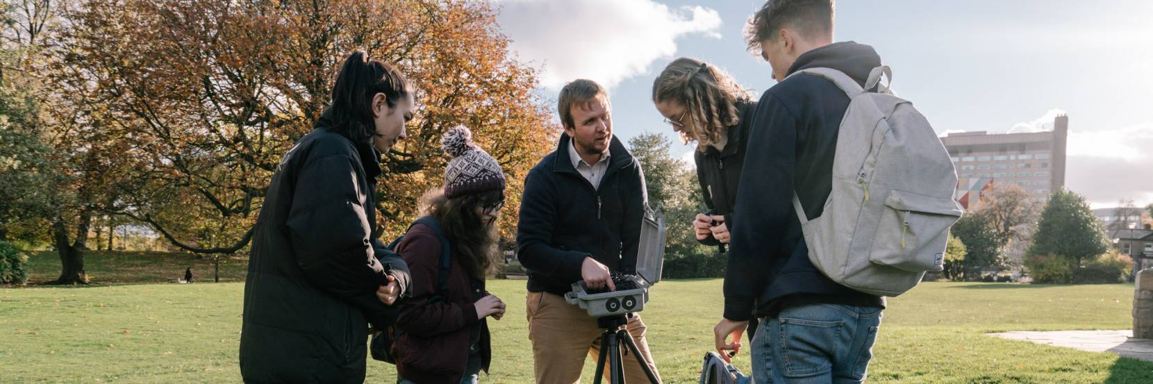 Dr Tom Pering shows students equipment that can be used to monitor volcanoes