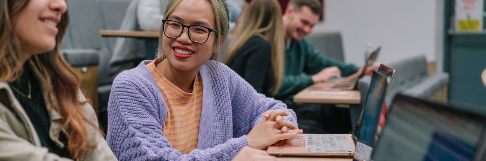 Students working together in a lecture theatre.