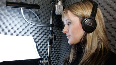 Women recording in a sound booth