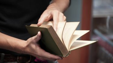 Student reading an old book