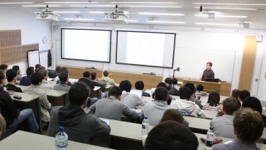 Students in a lecture theatre listening to a lecture.