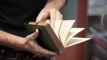 A person having a look through a book