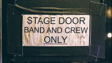 sign saying stage door and and crew only
