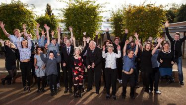 A group of people jumping 