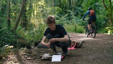 Biosciences student collecting data on a field trip