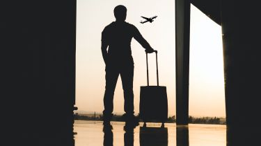 Silhouette of man at airport