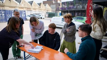 Amanda discusses field notebook with students