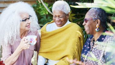 Three women talking in the garden