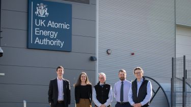 image showing University of Sheffield researchers and employees with UKAEA employees outside the UKAEA Sheffield building