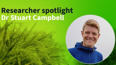 "Researcher Spotlight, Stuart Campbell" A picture of Stuart with the Institute's green gradient in the background.