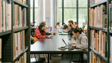 Students study in Western Bank Library's reading room