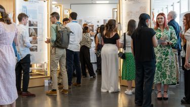 Employers, students, staff, family and guests browsing the exhibition on opening night