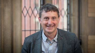Photograph of Professor Willy Kitchen standing in Firth Court