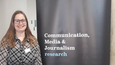 Gemma Horton next to a banner that reads: ˮ˷, Communication, Media and Journalism Research