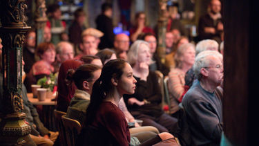 An audience sitting in a spiegeltent at Festival of the Mind 2018
