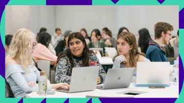 Three students working in a lecture theatre 