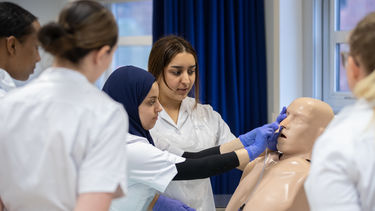 Students practising NG tube insertion