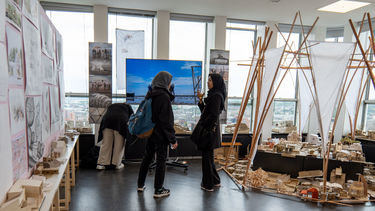 Two students having a conversation at the 2024 exhibition