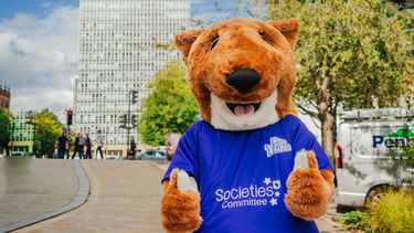 Societies committee mascot outside the arts tower
