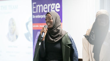 Lady speaking into microphone 