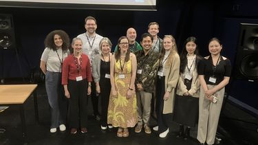 Photograph of the Muses Mind Machine staff smiling at the camera