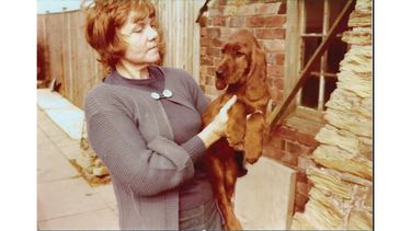 Michelle Webster looking at one of her beloved dogs.