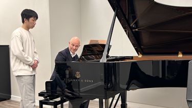 Student at a Steinway Piano in the Steinway showroom