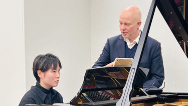 Student at a Steinway Piano in the Steinway showroom