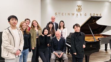 Group of students in Steinway showroom