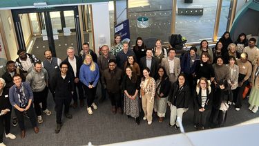 A group of people standing in a foyer