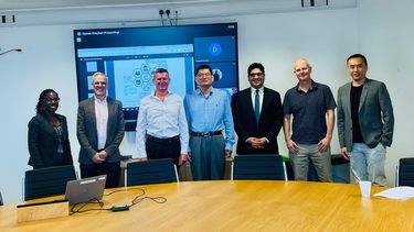 Yusen Xia and a group of Management School academics.