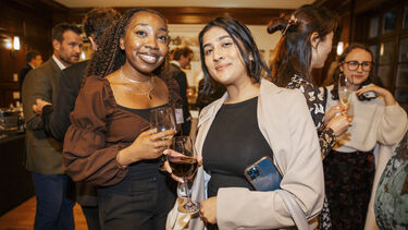 Two female alumni at a US alumni reception