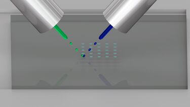 Schematic representation of Reactive inkjet printing of two inks (green and blue) reacting together on the substrate surface to form a new substance e.g. solid silk with encapsulated proteins.  