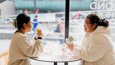 Two students enjoy lunch in the Diamond Kitchen