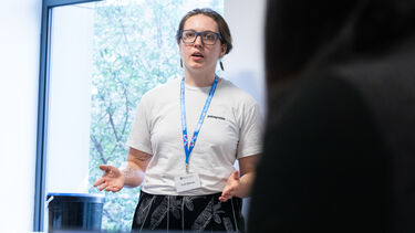 Management School PGR student presenting at the doctoral conference