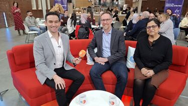 Three people sat on a sofa, including BBC news host Ben Boulos alongside Gurleen Popli and Jesse Matheson 