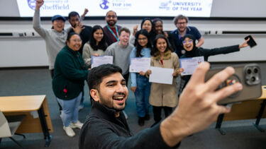 Student taking photos of winning teams 