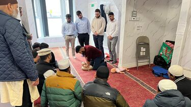Student demonstrate CPR to the community