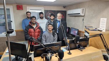 A group of students with Dr Adbul Rob in a podcast studio