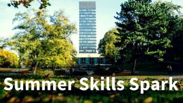 Summer Skills Spark on background image of Arts Tower surrounded by trees