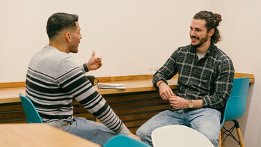 Two people talking to each other.