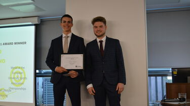 Tim Adams presents an ESPS award to Matteo Califano