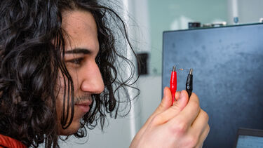 student with circuit part
