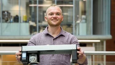 Man posing with rail device