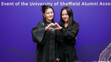 Two Beijing-based female University of Sheffield alumni making a heart symbol with their hands