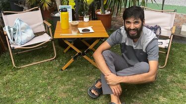 Anish Mishra sitting crossed legs smiling